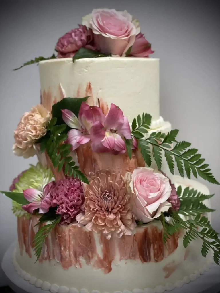 Decorated wedding cake with floral design included in wedding catering services in Elgin Illinois